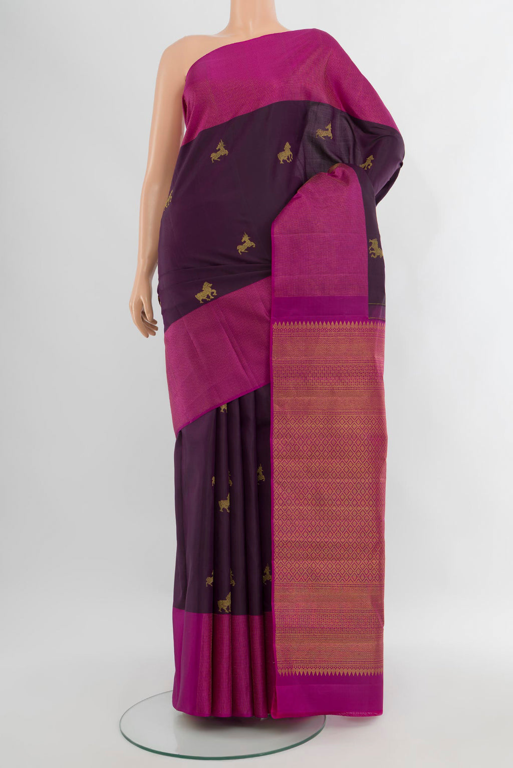 Purple Kanjivaram Silk Saree with Zari Butta on the body and Zari Border.  displayed on a mannequin
