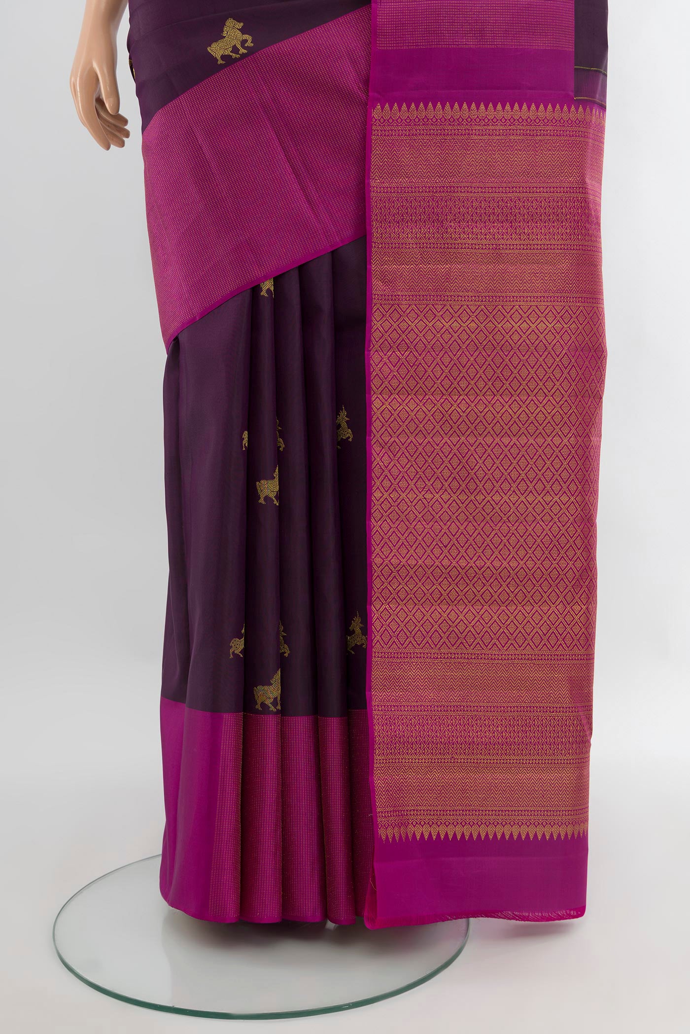 Pleats and pallu of Purple Kanjivaram Silk Saree with Zari Butta on the body and Zari Border. 