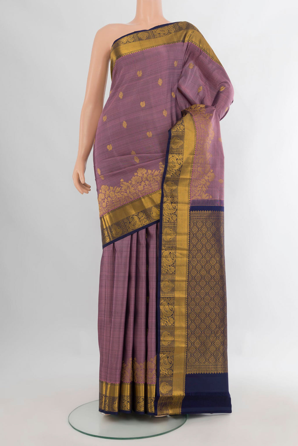 Pure Silk Lavender Kanjivaram Saree with Zari Butta on the body and Zari Border.  displayed on a mannequin