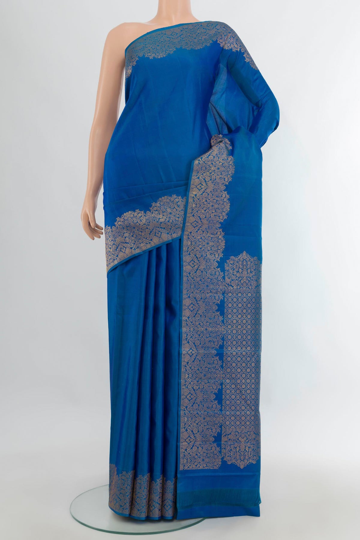 Pure Silk Blue Kanchipuram Saree with Plain Body and Fancy Border.  displayed on a mannequin