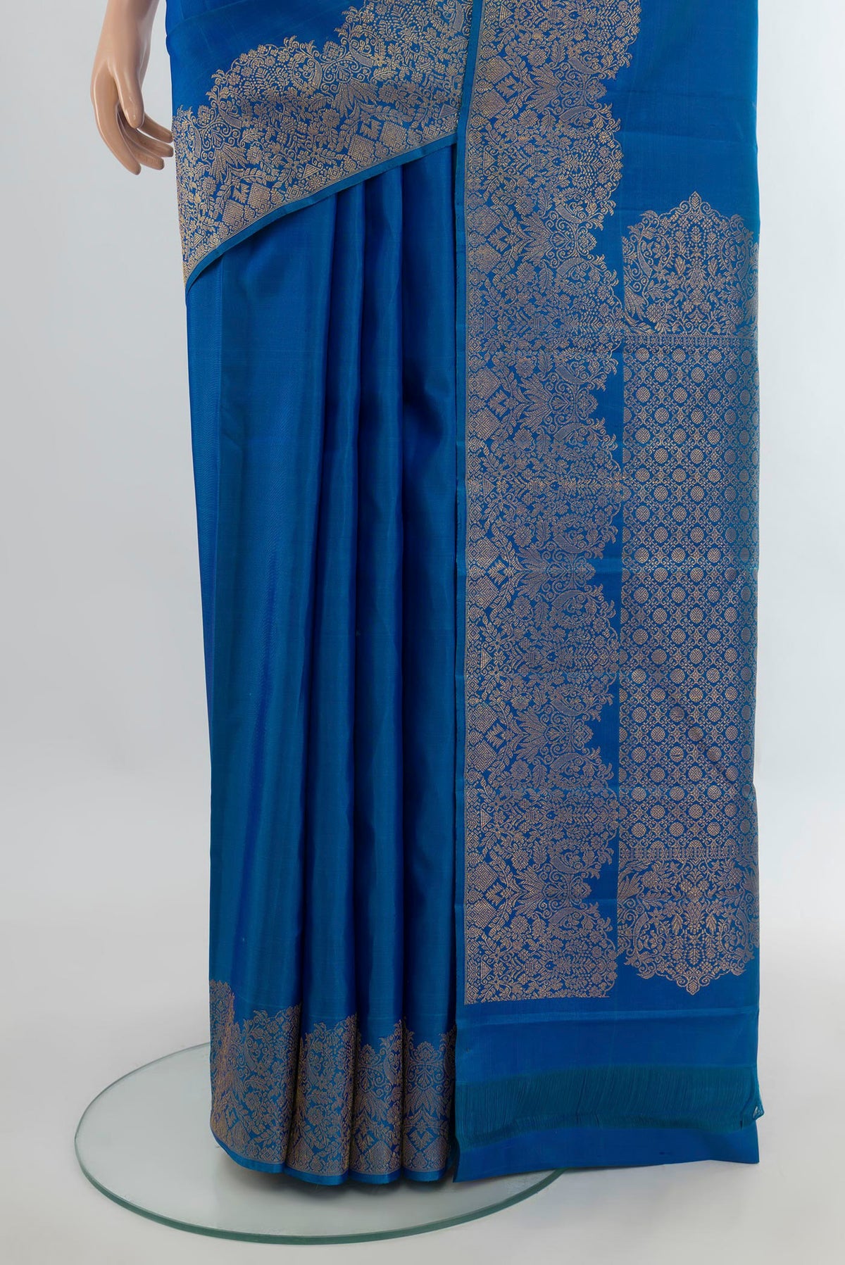 Pleats and pallu of Pure Silk Blue Kanchipuram Saree with Plain Body and Fancy Border. 