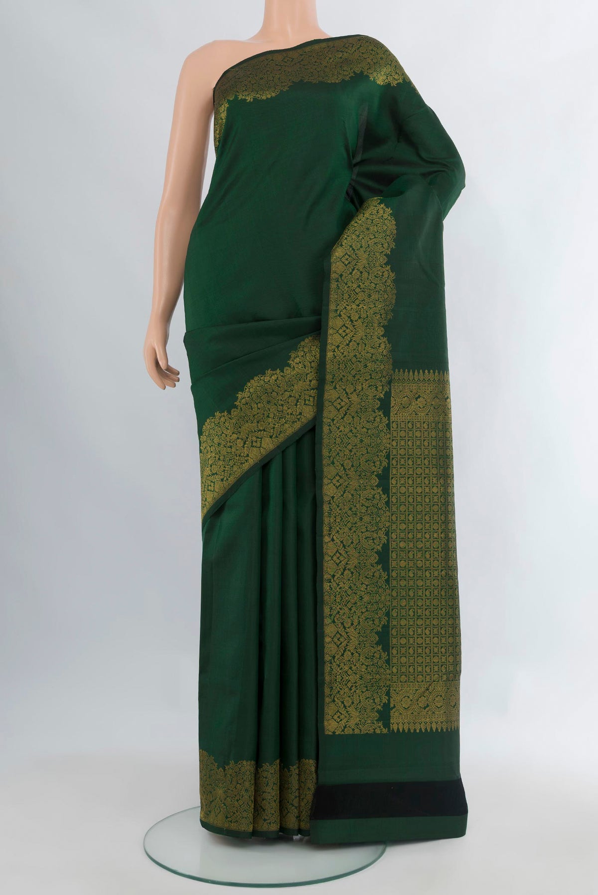 Pure Silk Bottle Green Kanchipuram Saree with Plain Body and Fancy Border.  displayed on a mannequin