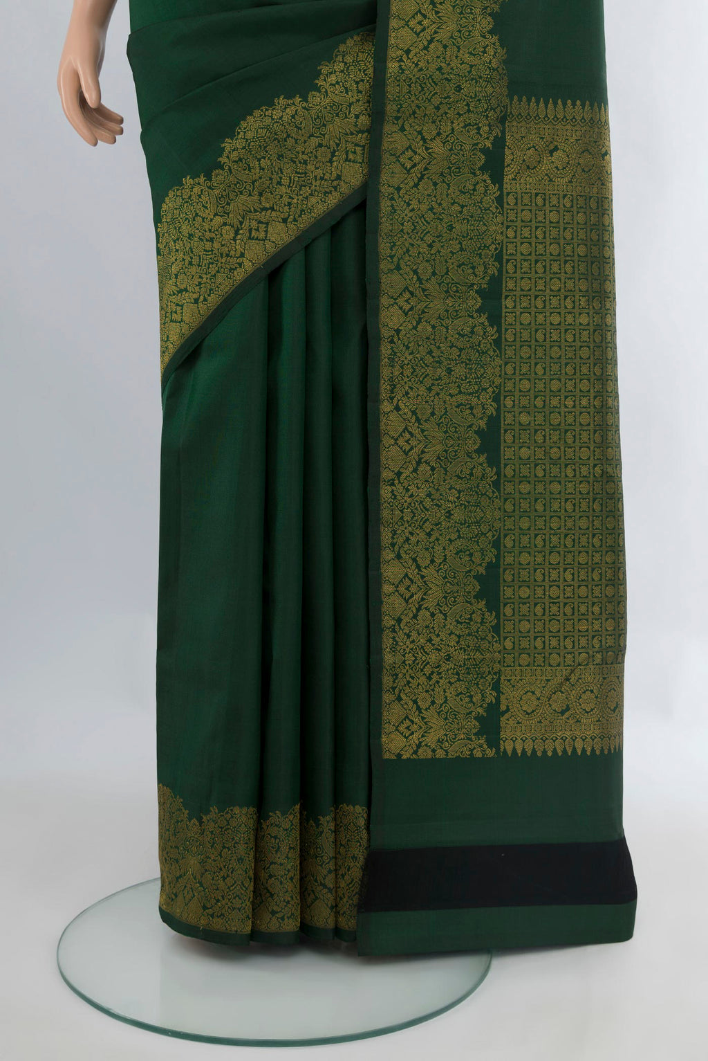 Pleats and pallu of Pure Silk Bottle Green Kanchipuram Saree with Plain Body and Fancy Border. 