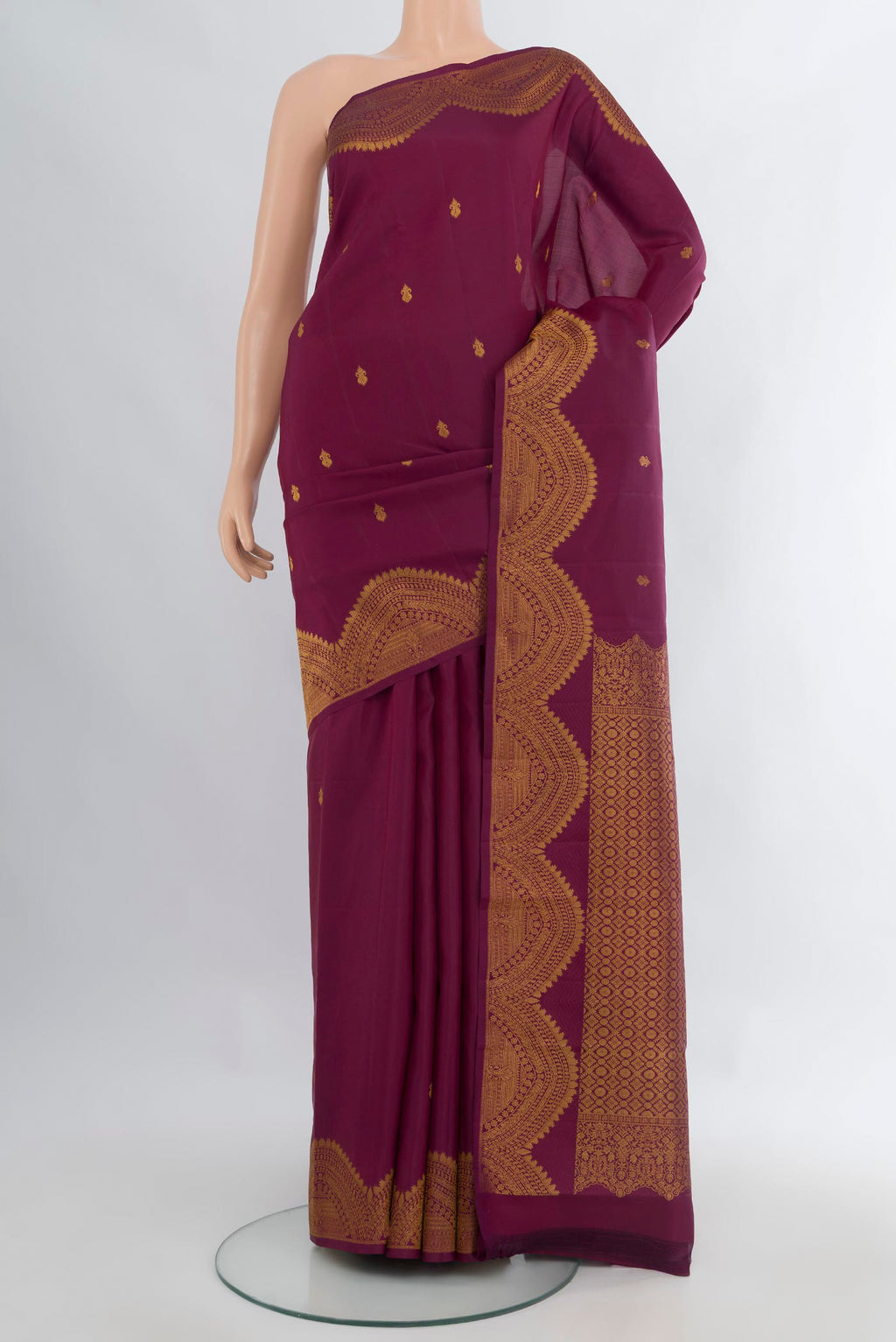 Pure Silk Purple Kanjivaram Saree with Zari Butta on the body and Fancy Border.  displayed on a mannequin