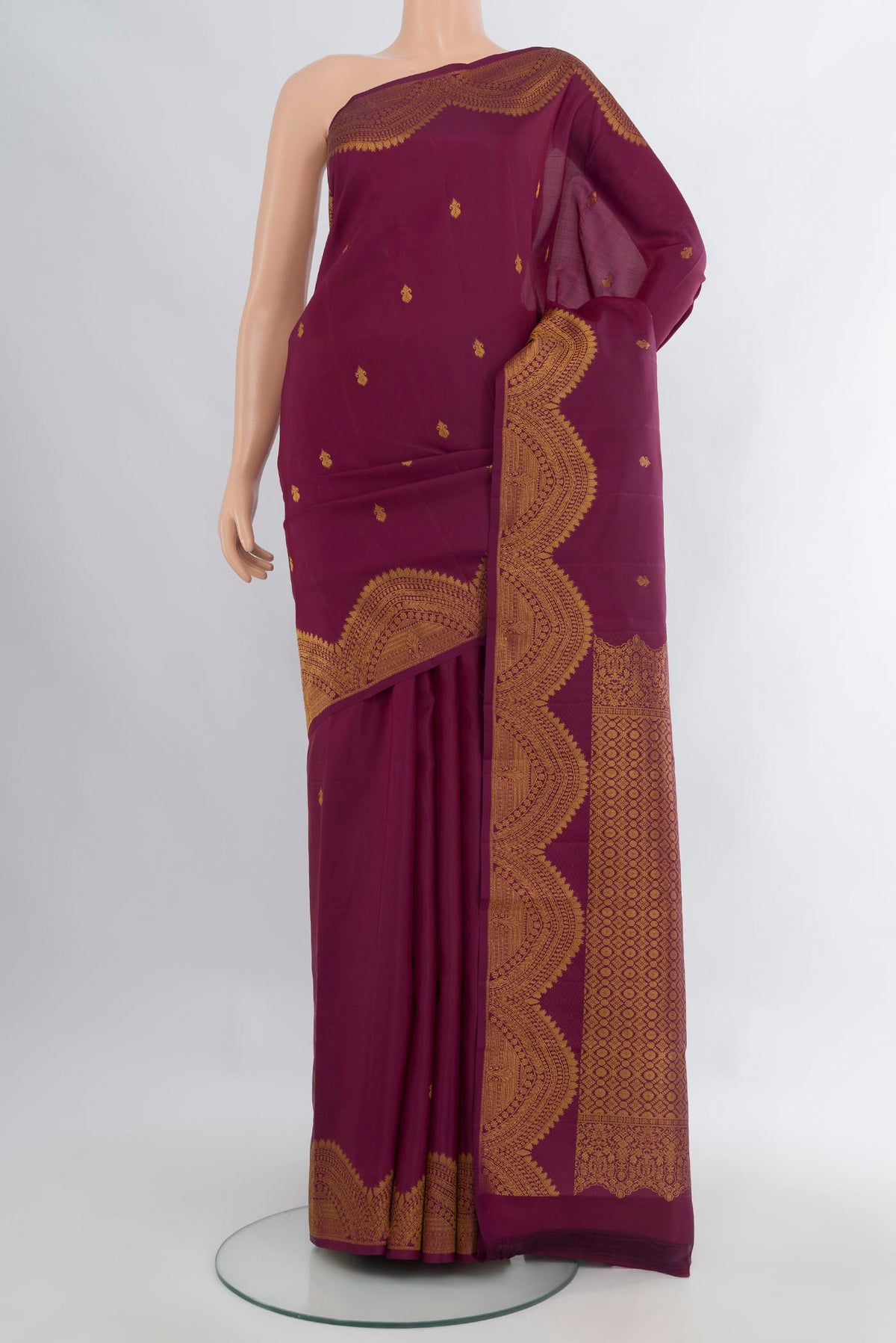 Pure Silk Purple Kanjivaram Saree with Zari Butta on the body and Fancy Border.  displayed on a mannequin
