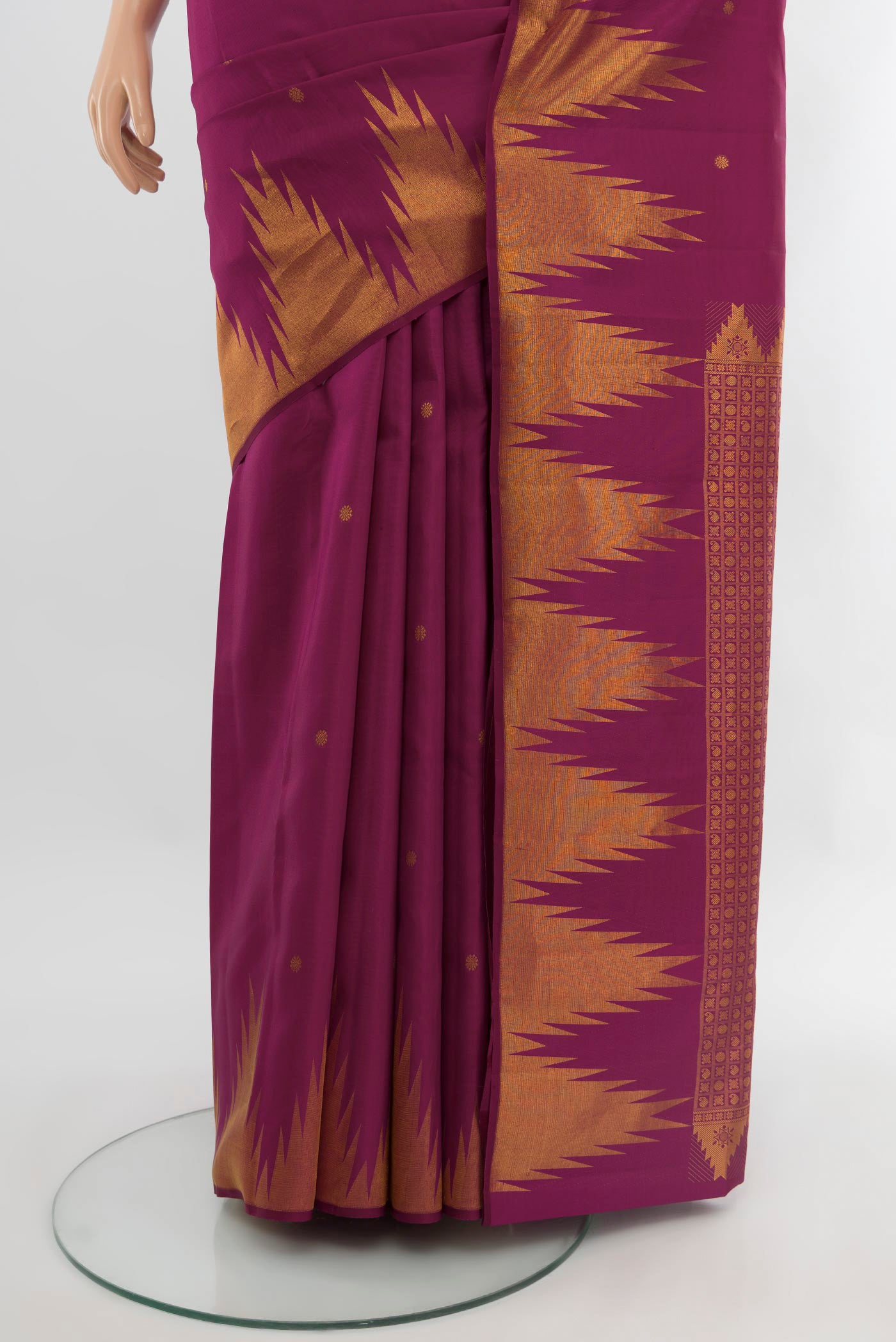 Pleats and pallu of Magenta Kanchipuram Silk Saree with Zari Butta on the body and Temple Border. 