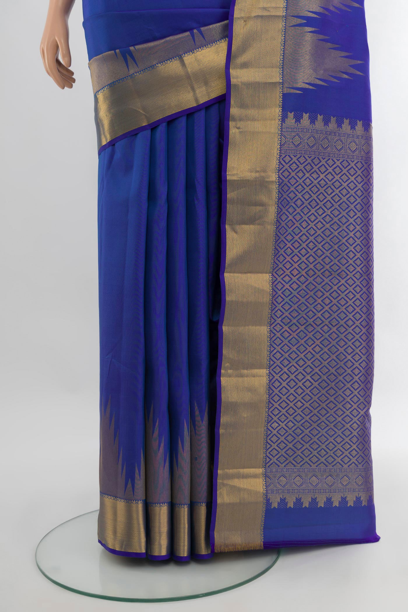 Pleats and pallu of Royal Blue Kanchipuram Silk Saree with Plain Body and Temple Border. 