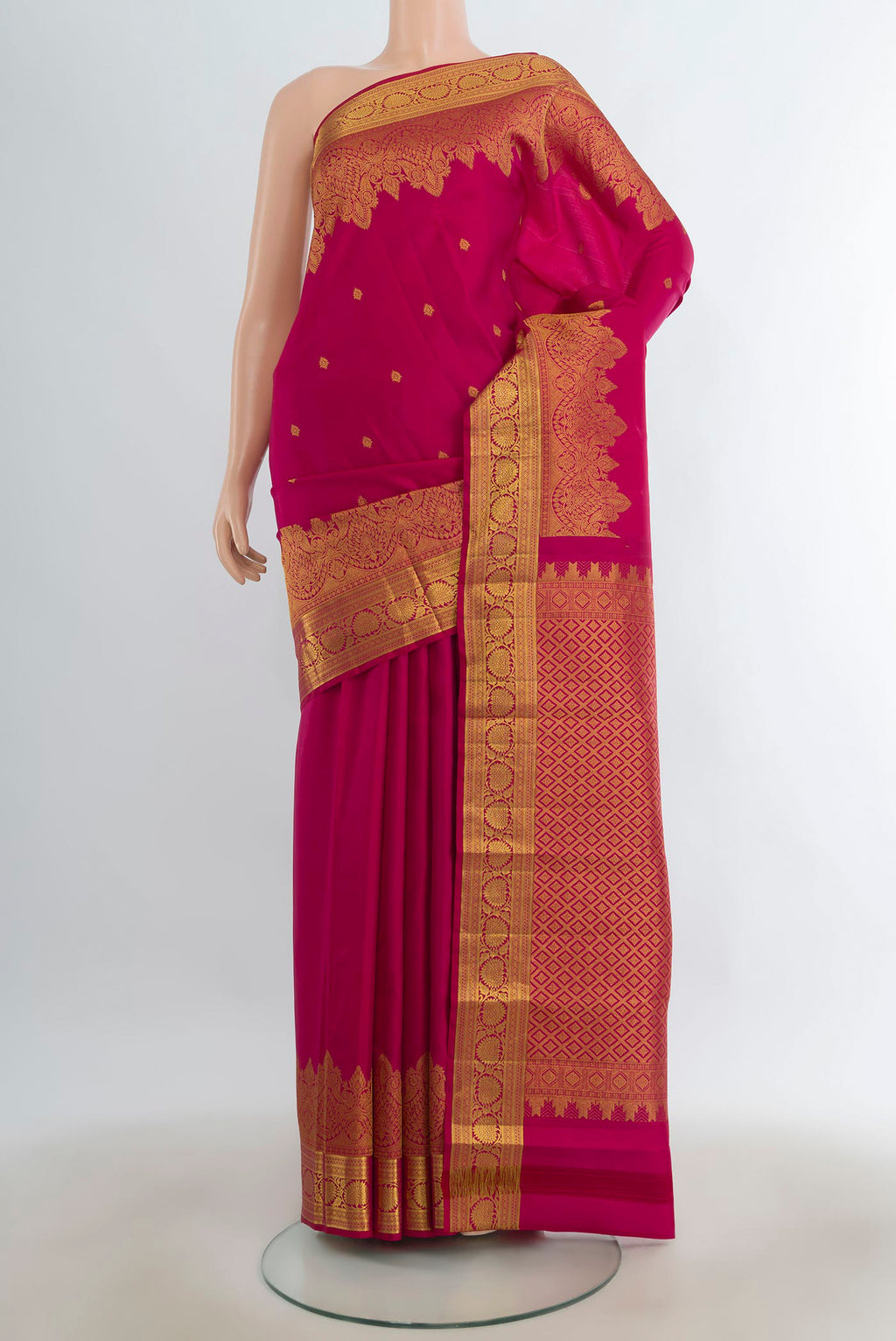 Pure Silk Dark Pink Kanjivaram Saree with Zari Butta on the body and Silk Border.  displayed on a mannequin