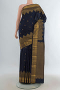 Pure Silk Navy Blue Kanjivaram Saree with Zari Butta on the body and Temple Border.  displayed on a mannequin