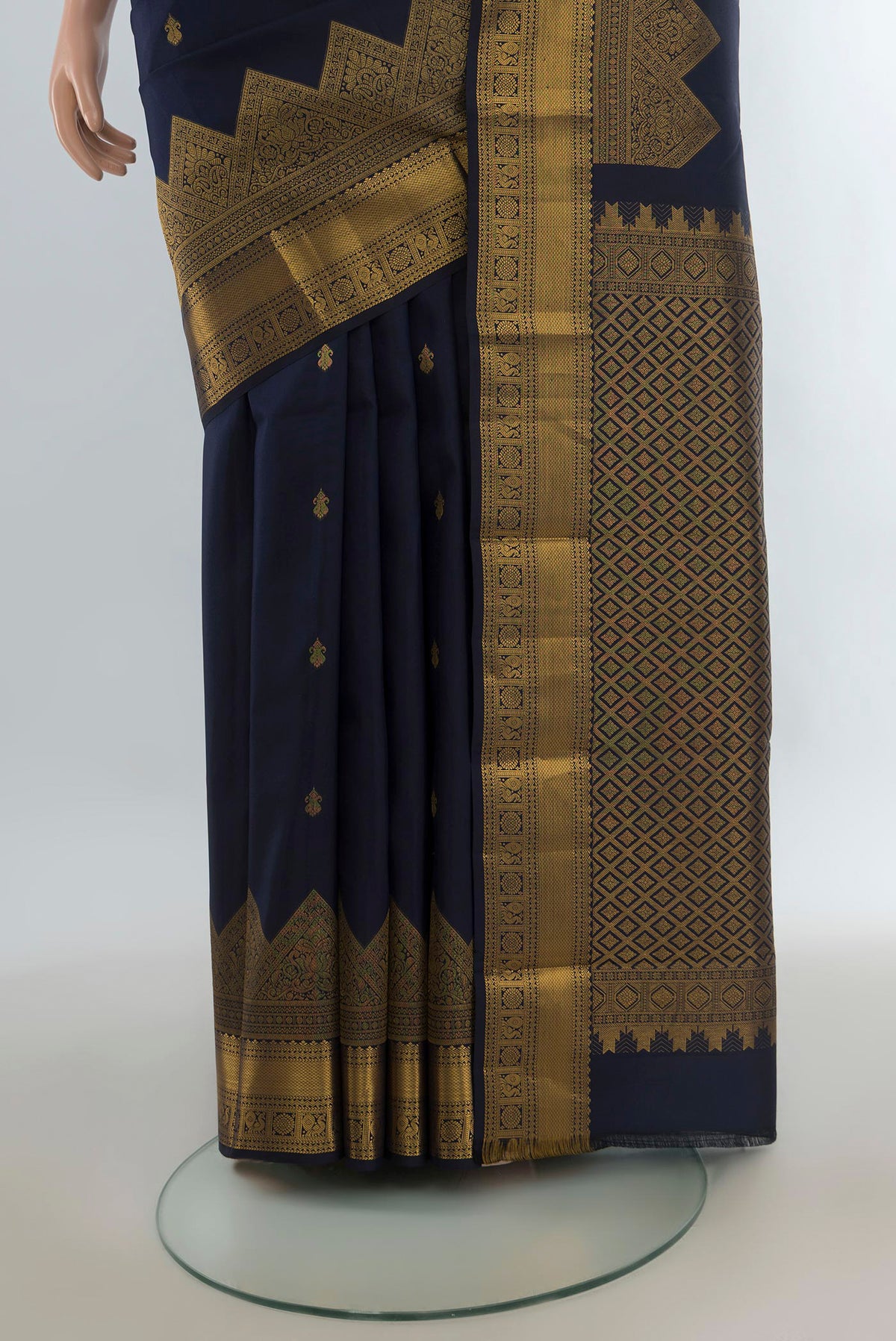 Pleats and pallu of Pure Silk Navy Blue Kanjivaram Saree with Zari Butta on the body and Temple Border. 