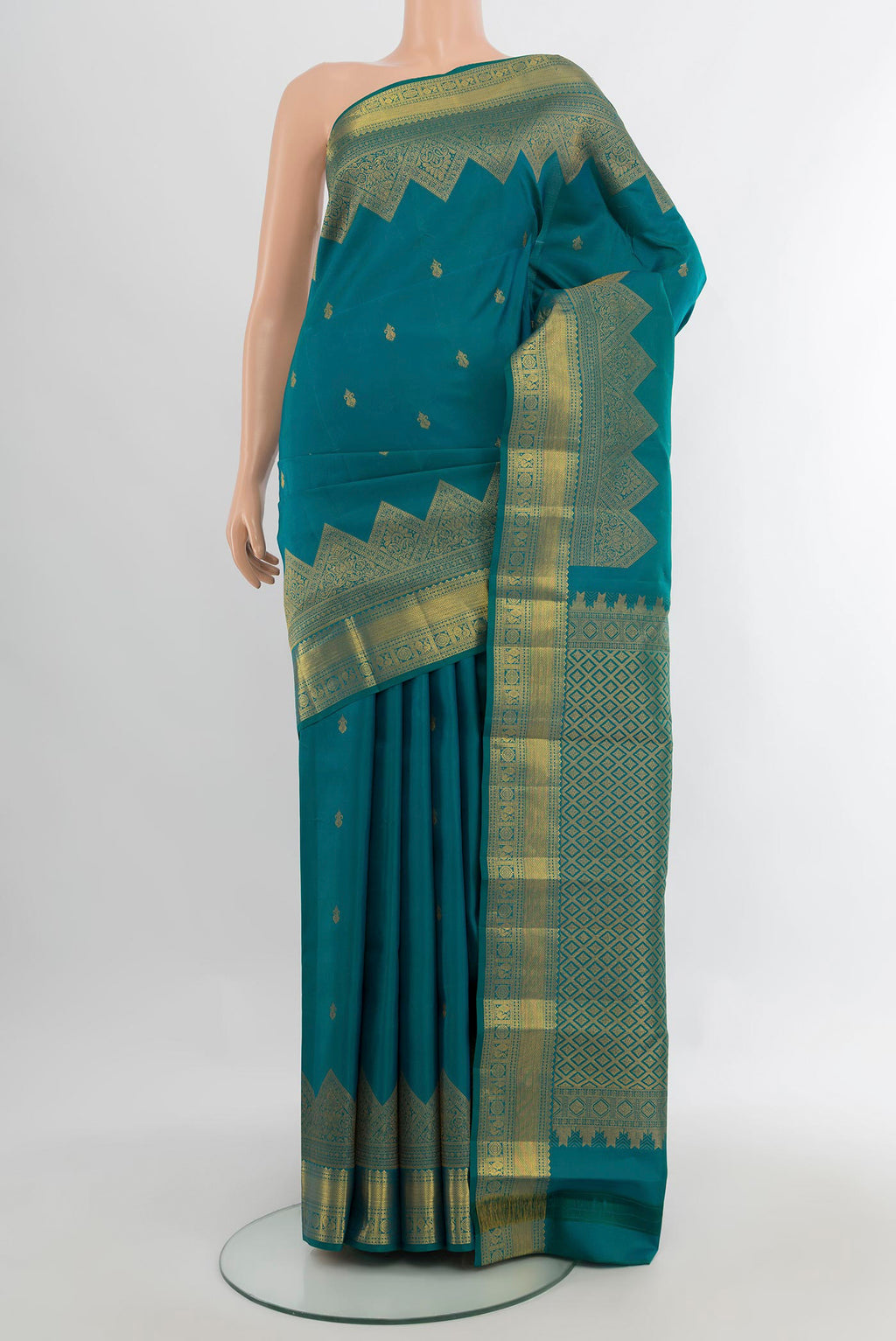 Pure Silk Peacock Blue Kanjivaram Saree with Zari Butta on the body and Fancy Border.  displayed on a mannequin