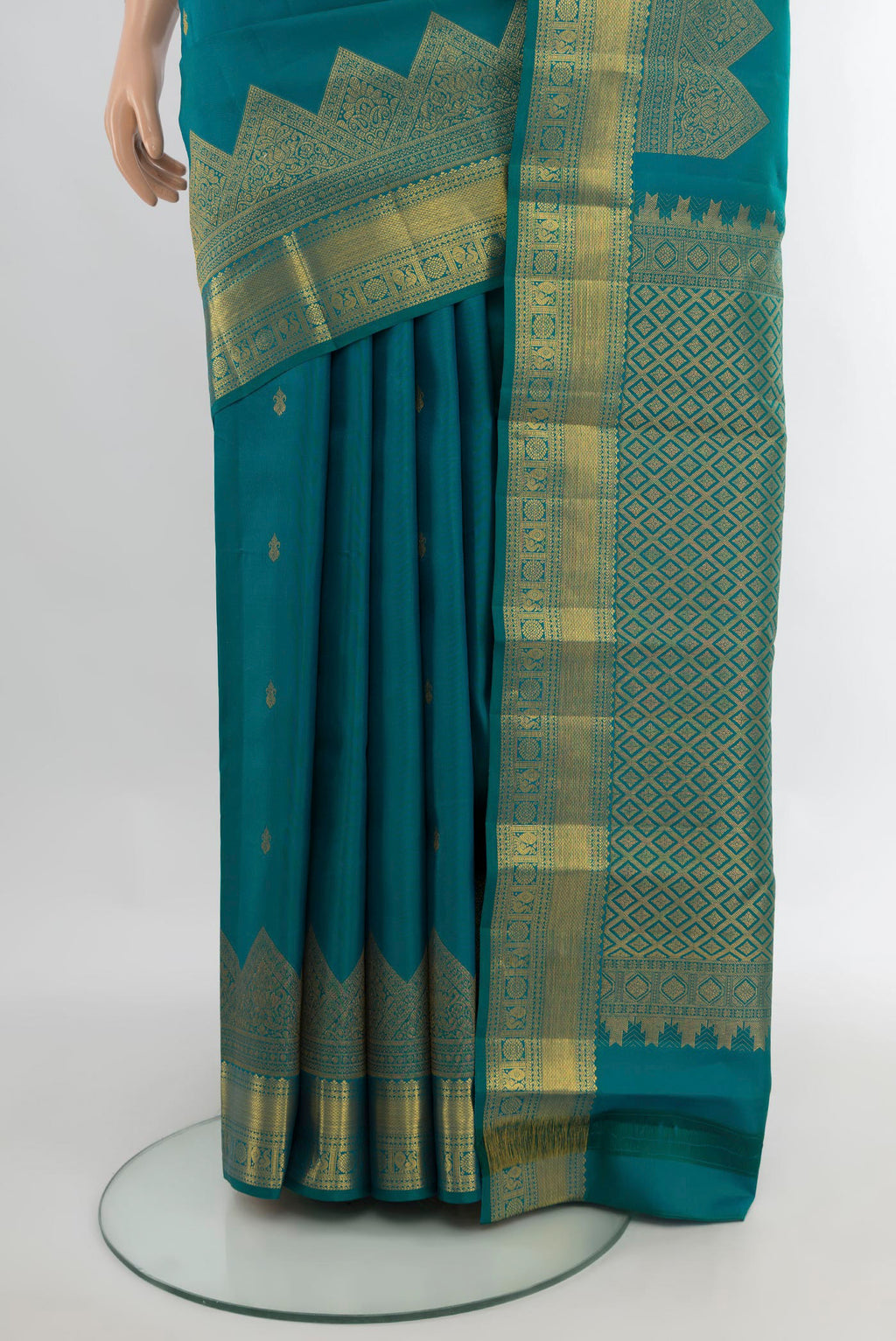 Pleats and pallu of Pure Silk Peacock Blue Kanjivaram Saree with Zari Butta on the body and Fancy Border. 