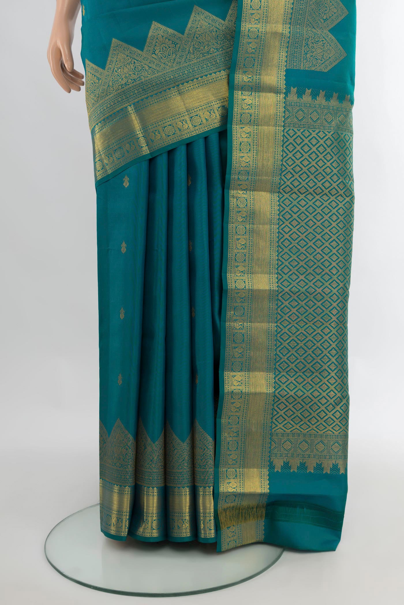 Pleats and pallu of Pure Silk Peacock Blue Kanjivaram Saree with Zari Butta on the body and Fancy Border. 