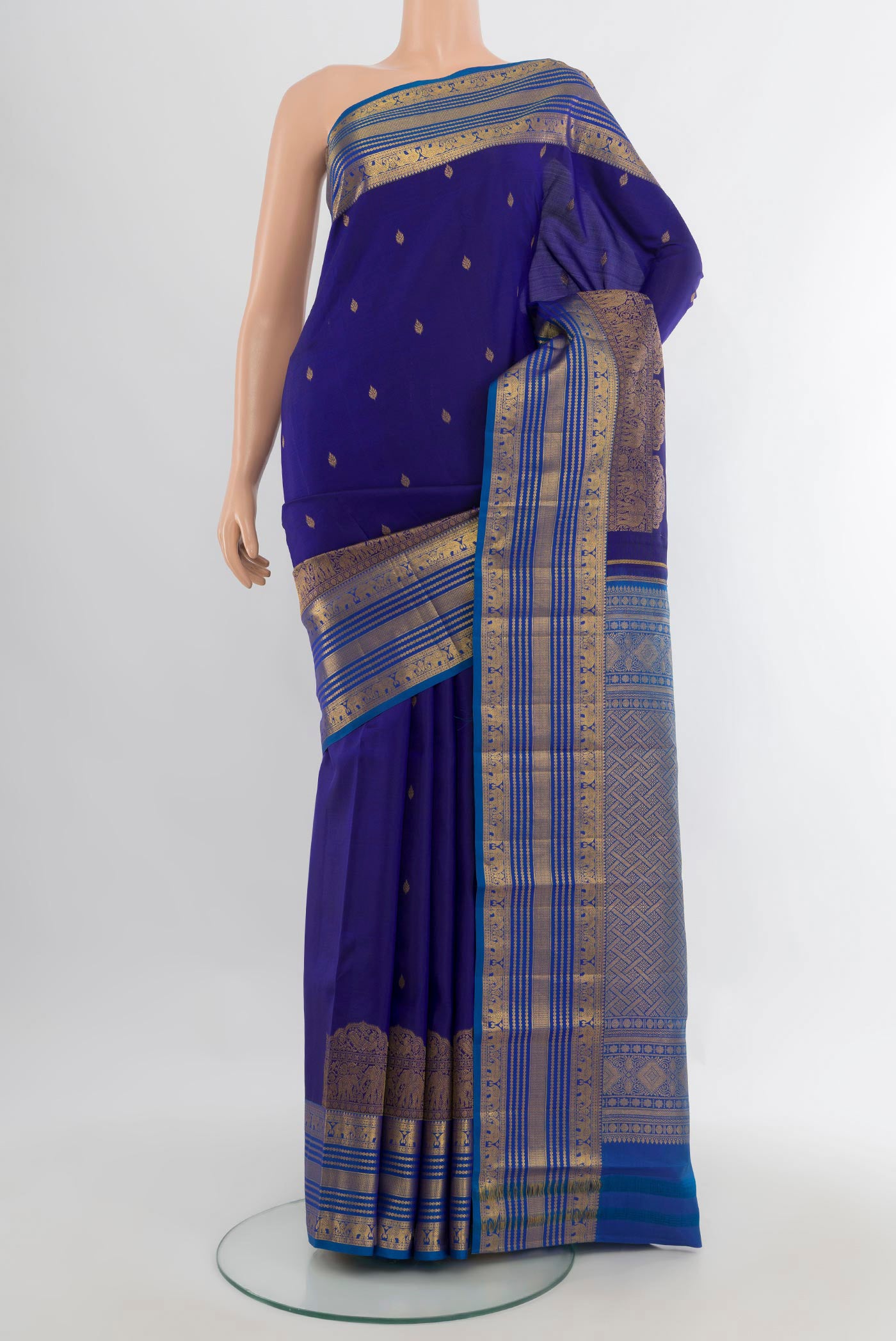 Pure Silk Dark Blue Kanjivaram Saree with Zari Butta on the body and Zari Border.  displayed on a mannequin
