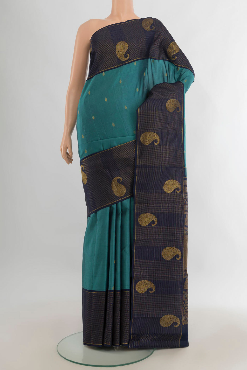 Pure Silk Peacock Blue Kanchipuram Saree with Zari Butta on the body and Zari Border.  displayed on a mannequin