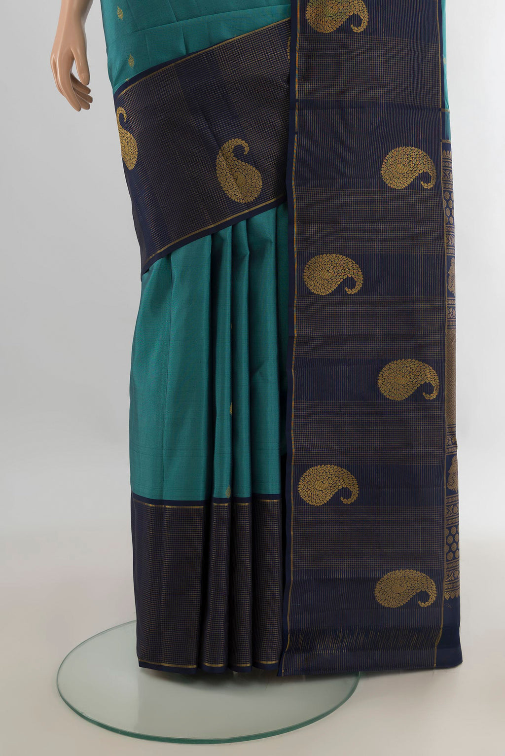 Pleats and pallu of Pure Silk Peacock Blue Kanchipuram Saree with Zari Butta on the body and Zari Border. 