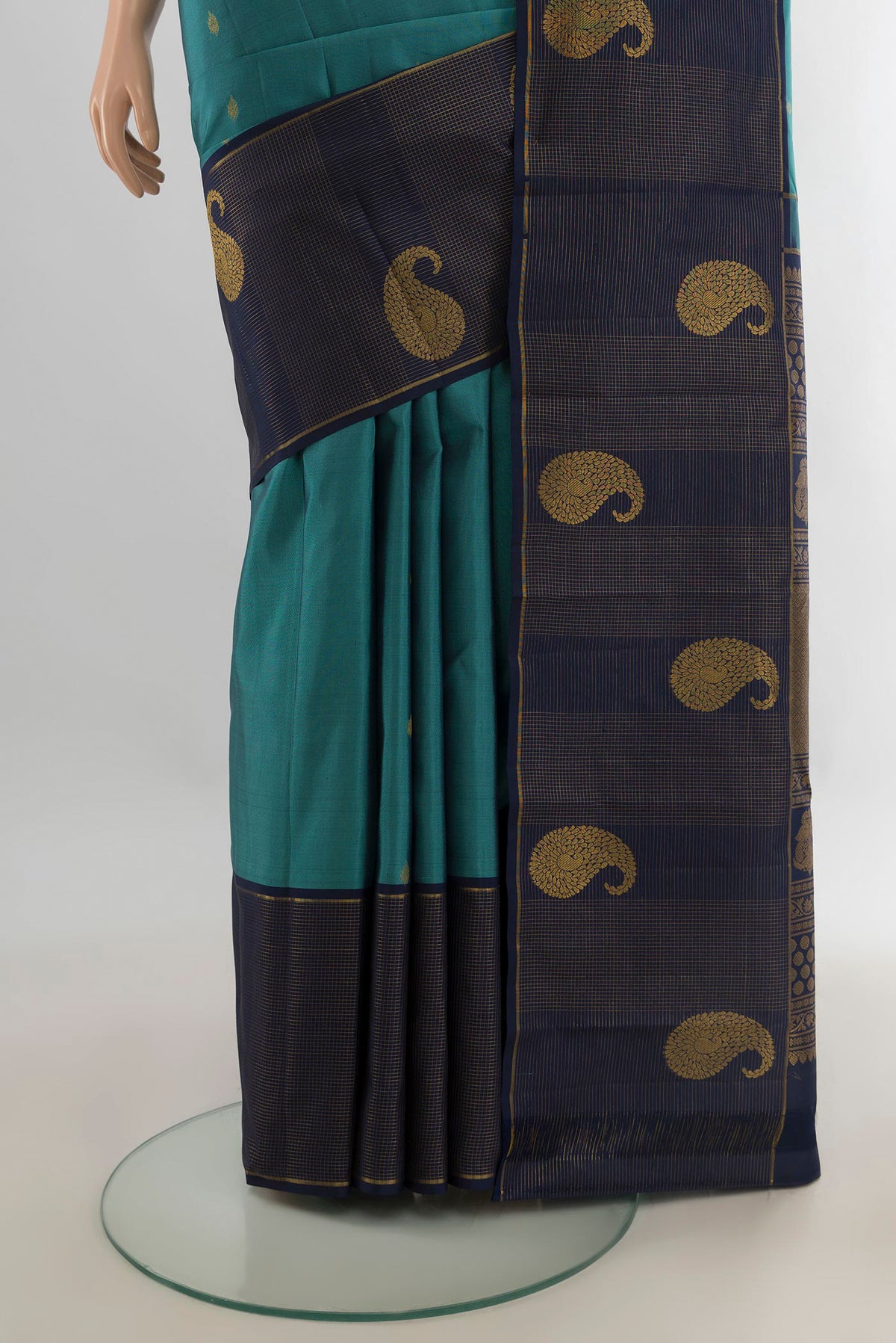 Pleats and pallu of Pure Silk Peacock Blue Kanchipuram Saree with Zari Butta on the body and Zari Border. 