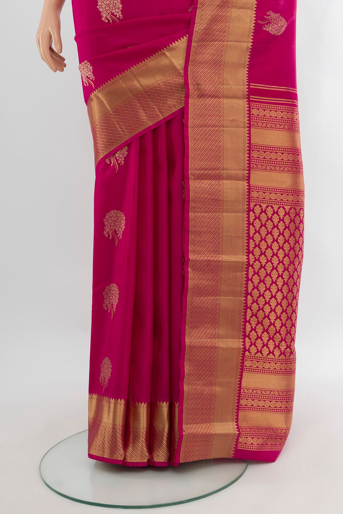 Pleats and pallu of Pink Kanjivaram Silk Saree with Zari Butta on the body and Zari Border. 