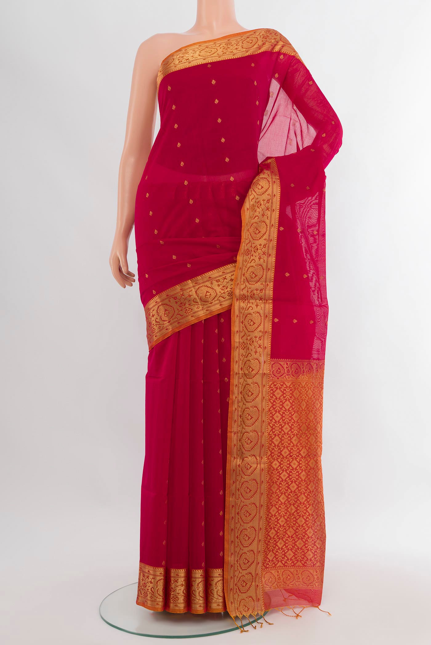 Dark Pink Silk Cotton Saree with Zari Butta on the body and Zari Border.  displayed on a mannequin