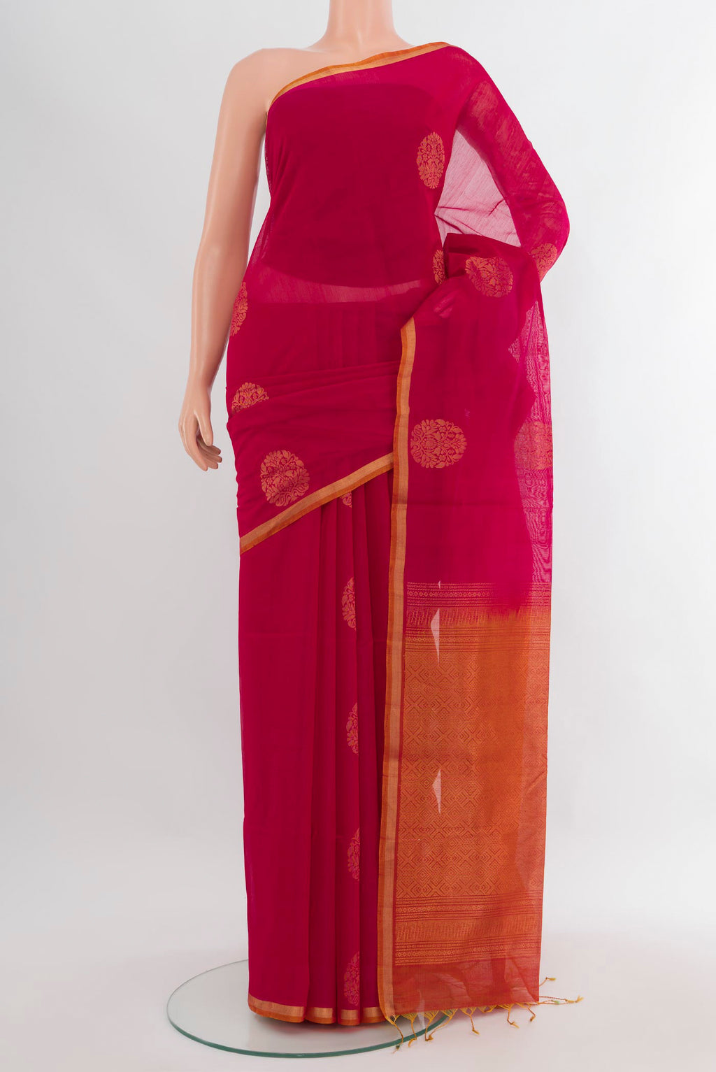 Dark Pink Silk Cotton Saree with Zari Butta on the body and Zari Border.  displayed on a mannequin
