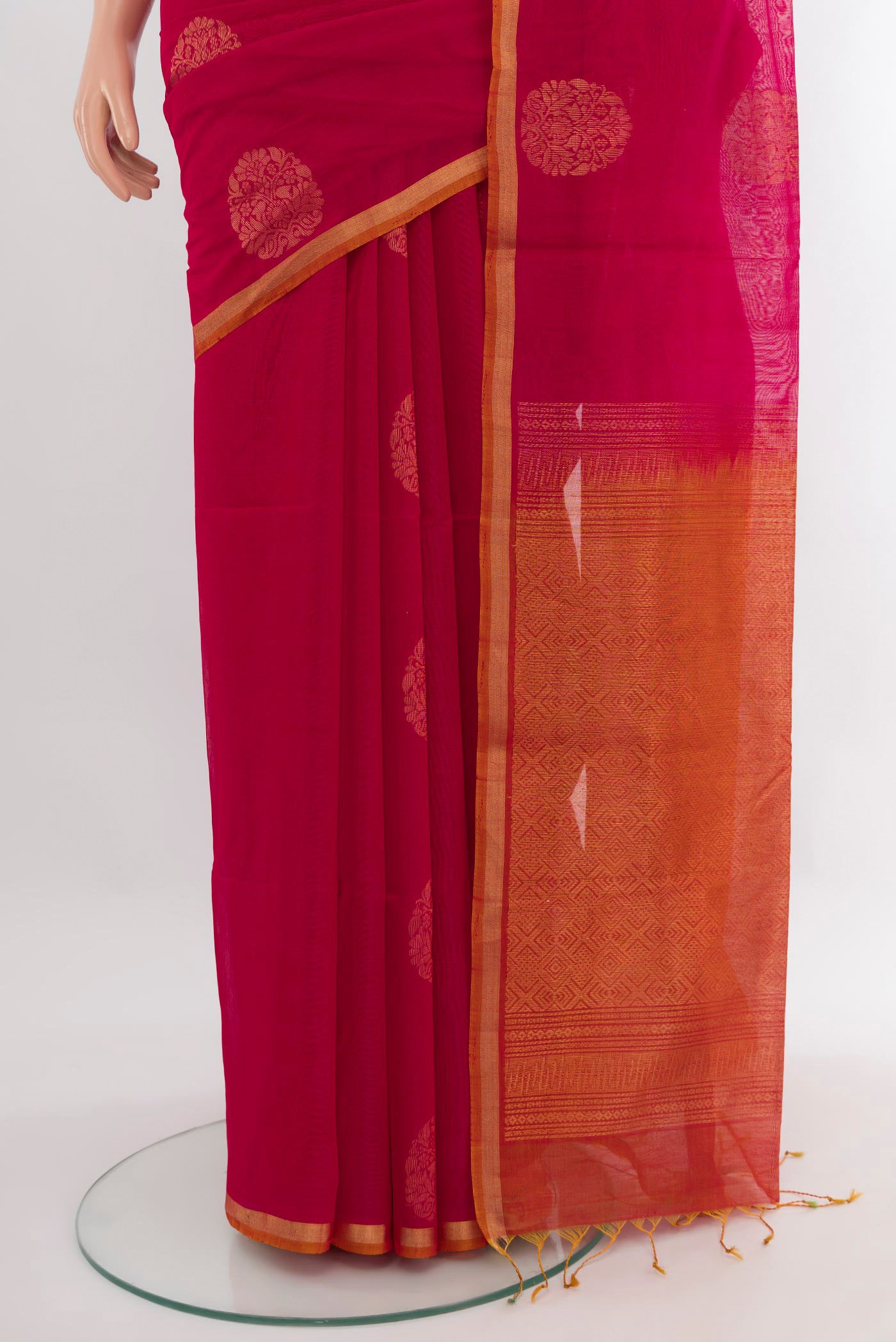 Pleats and pallu of Dark Pink Silk Cotton Saree with Zari Butta on the body and Zari Border. 