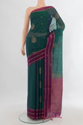Peacock Blue Silk Cotton Saree with Zari Butta on the body and Plain Border.  displayed on a mannequin