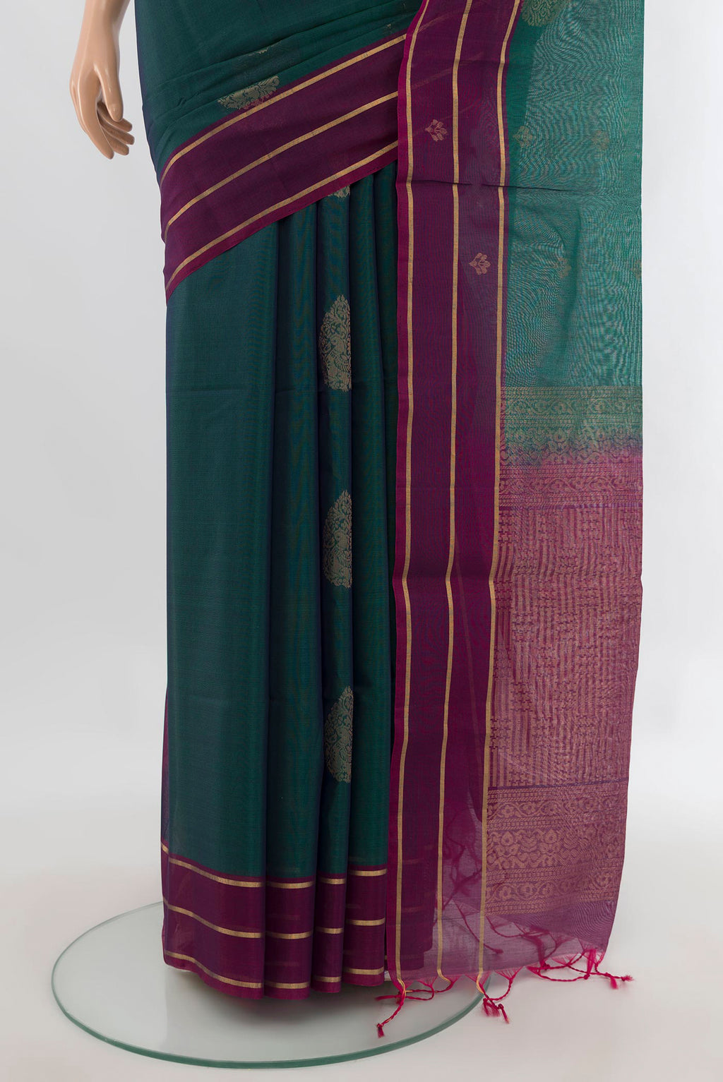 Pleats and pallu of Peacock Blue Silk Cotton Saree with Zari Butta on the body and Plain Border. 