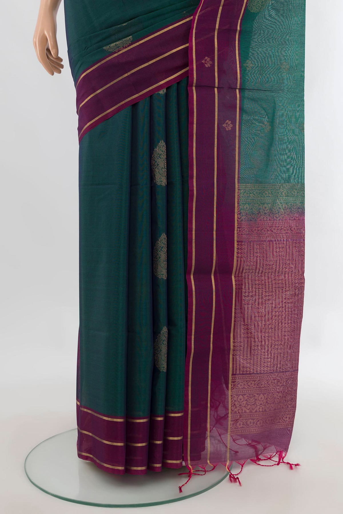 Pleats and pallu of Peacock Blue Silk Cotton Saree with Zari Butta on the body and Plain Border. 