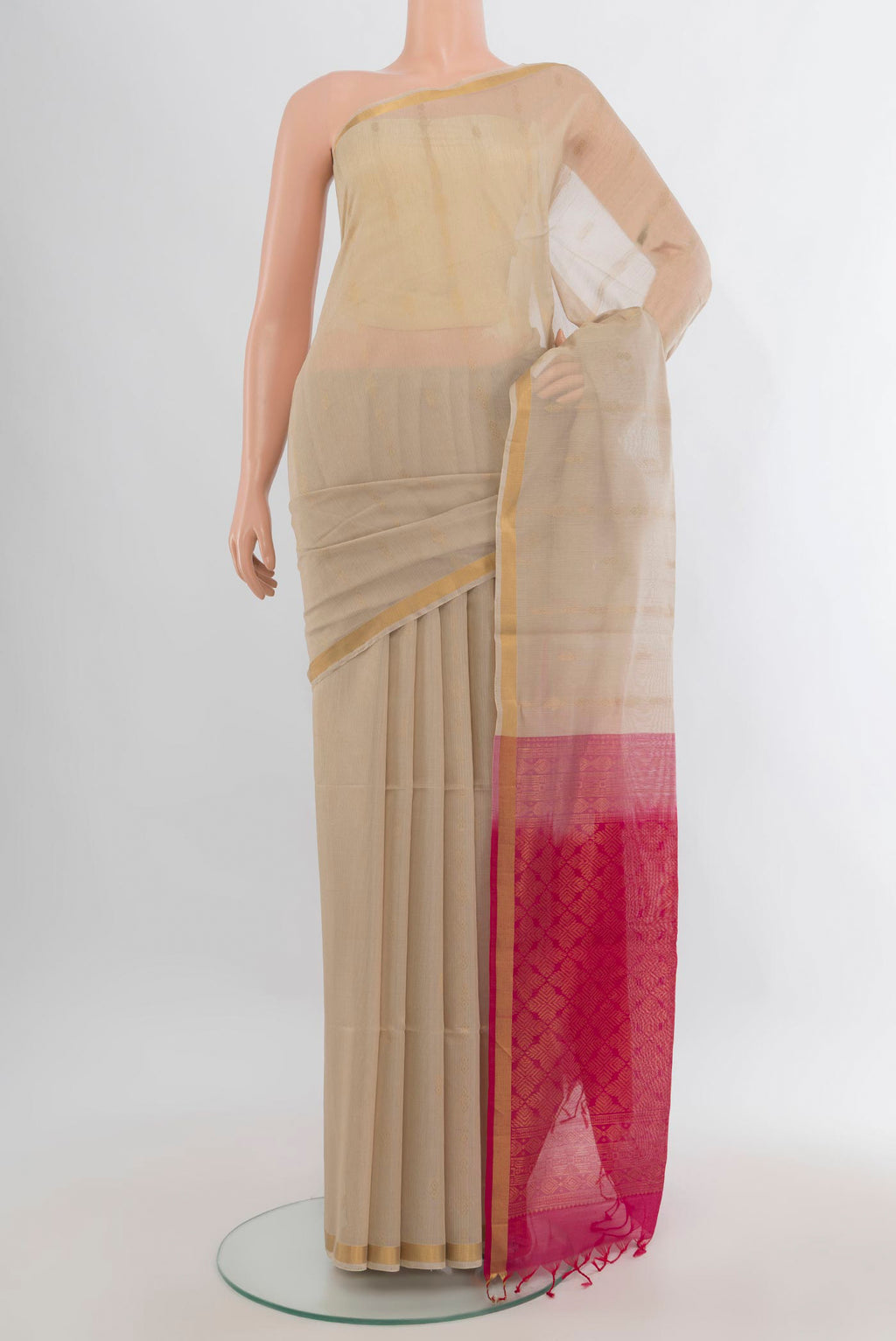 Cream Silk Cotton Saree with Zari Butta on the body and Zari Border.  displayed on a mannequin