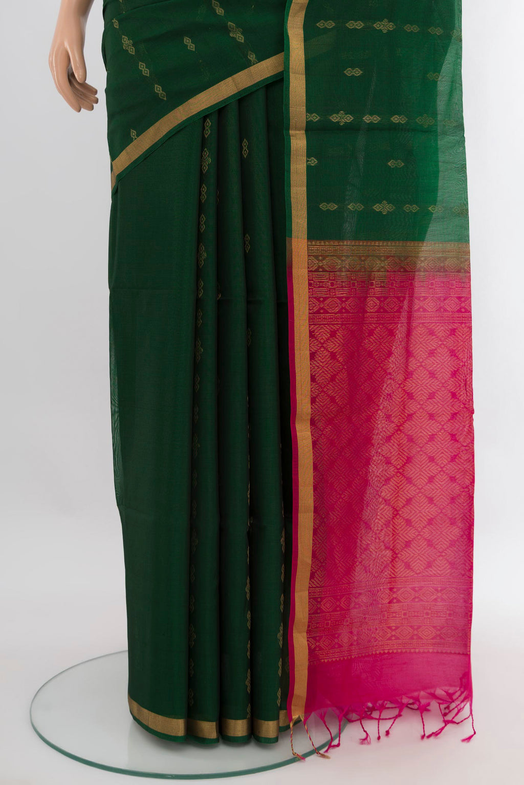 Pleats and pallu of Bottle Green Silk Cotton Saree with Zari Butta on the body and Zari Border. 