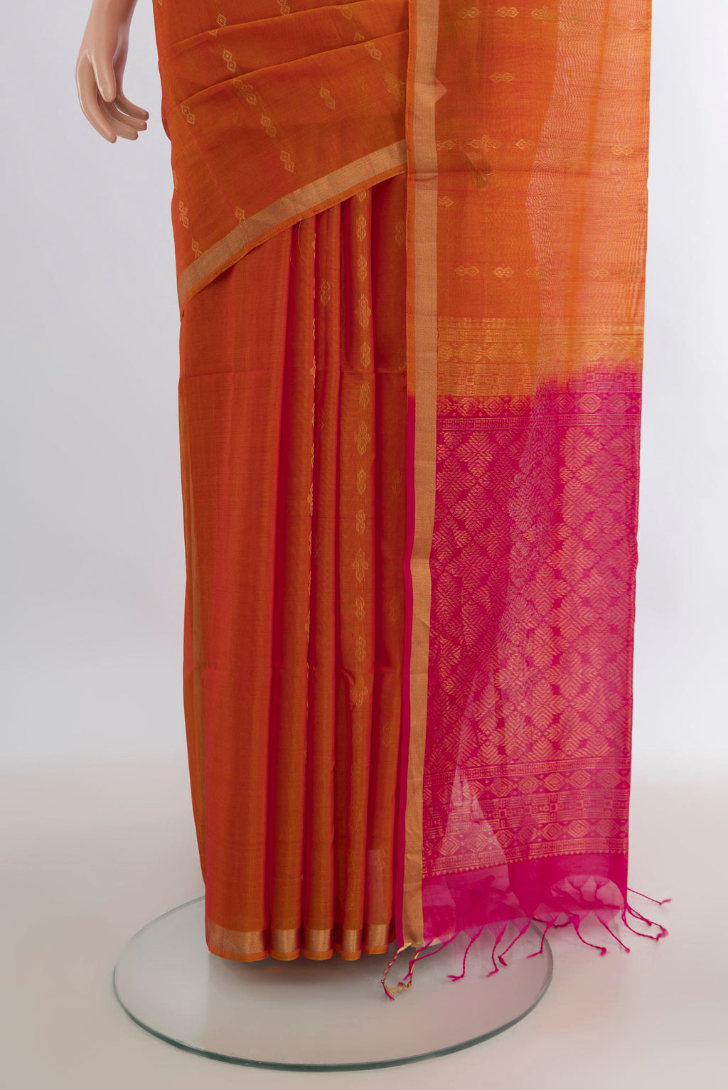 Pleats and pallu of Mustard Silk Cotton Saree with Zari Butta on the body and Zari Border. 
