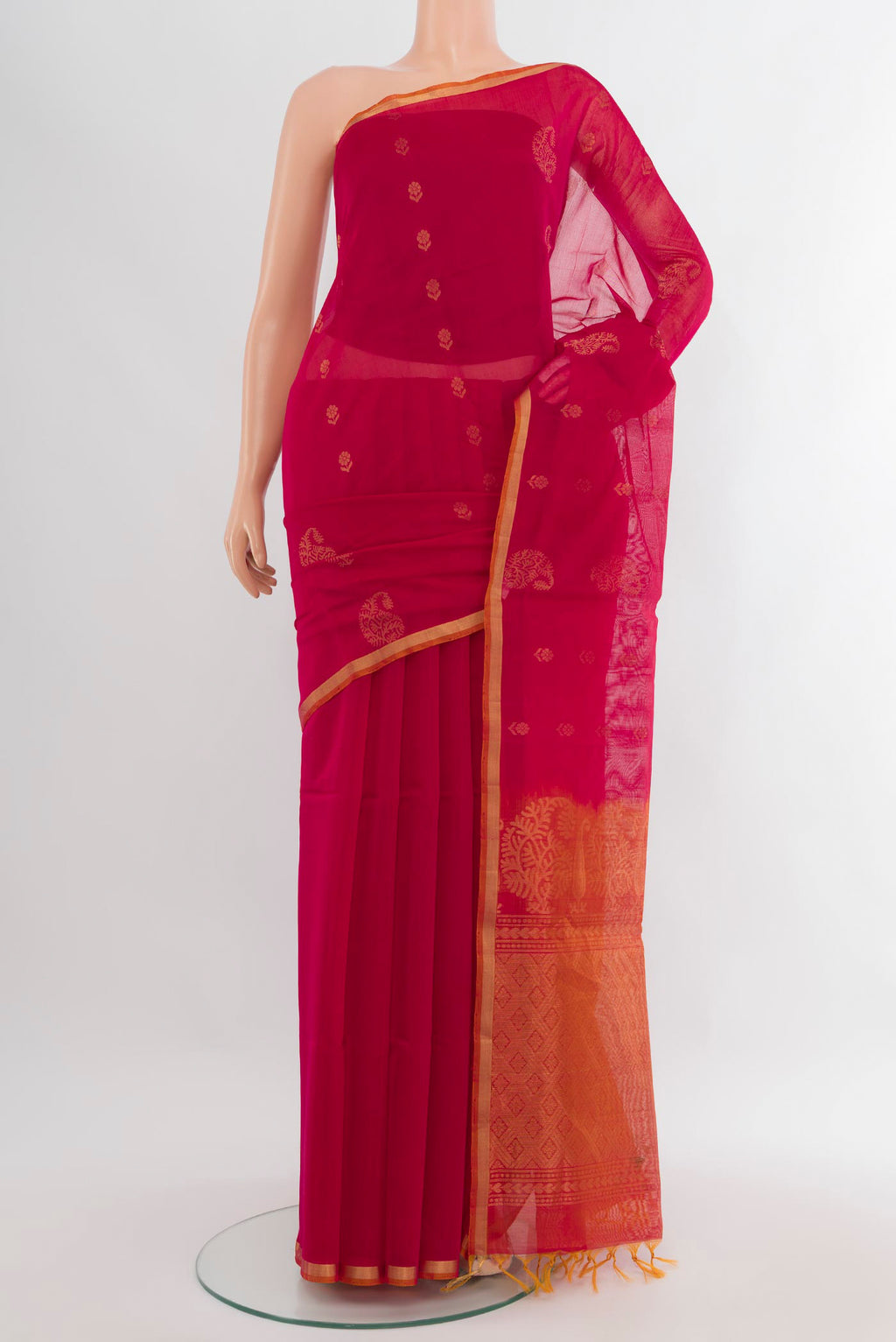 Dark Pink Silk Cotton Saree with Zari Butta on the body and Zari Border.  displayed on a mannequin
