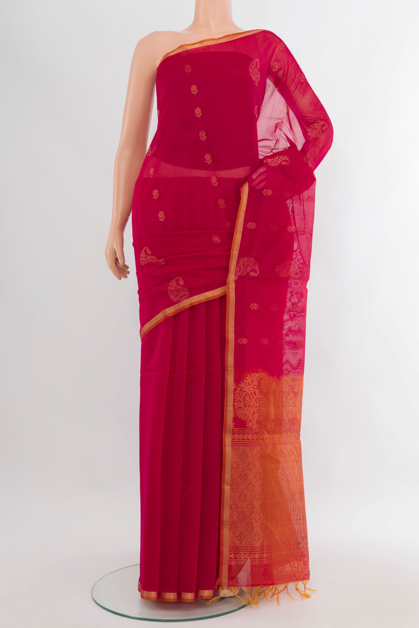 Dark Pink Silk Cotton Saree with Zari Butta on the body and Zari Border.  displayed on a mannequin