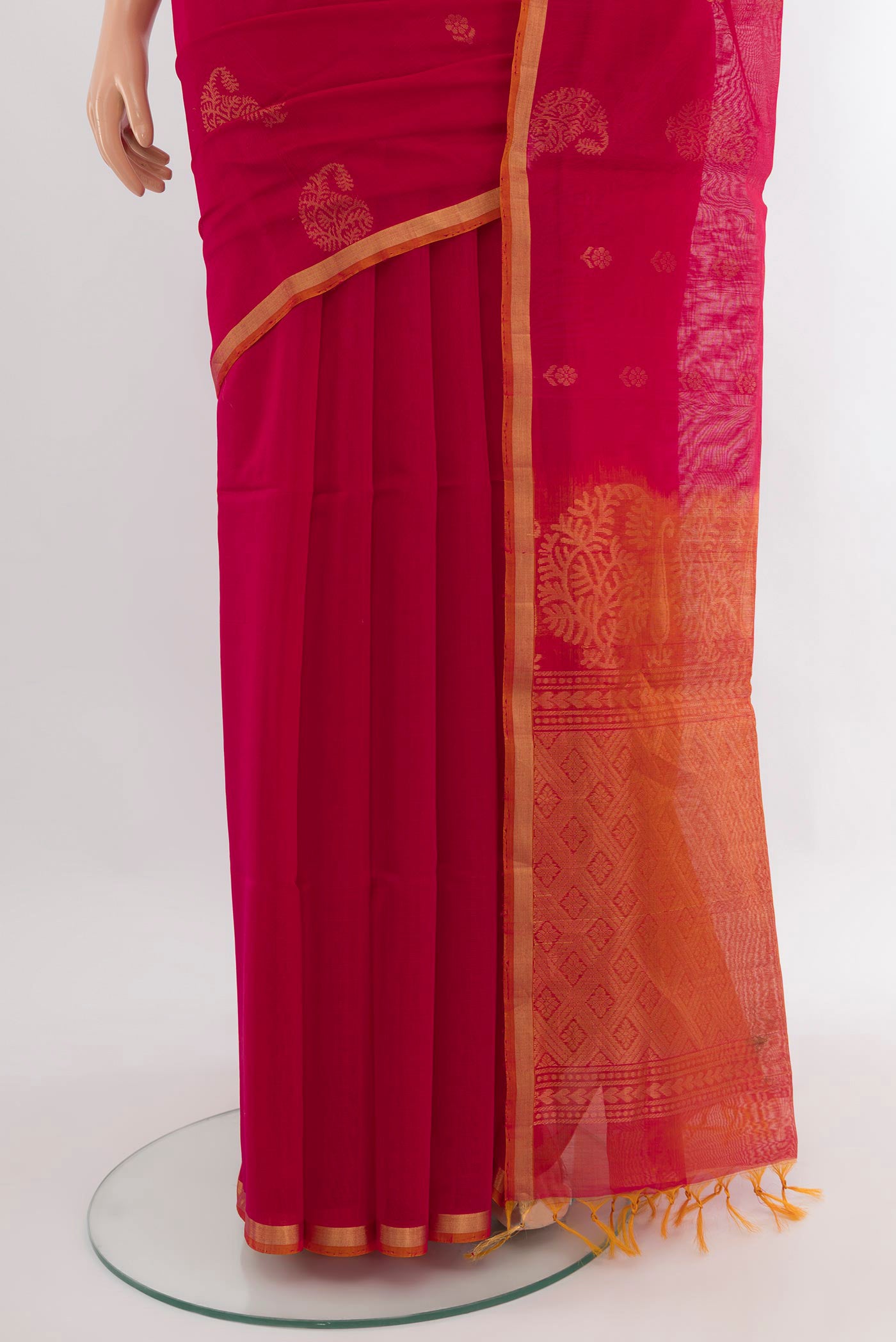 Pleats and pallu of Dark Pink Silk Cotton Saree with Zari Butta on the body and Zari Border. 