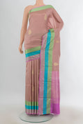 Pure Silk Rose Gold Banarasi Katan Saree with Zari Butta on the body and Zari Border.  displayed on a mannequin