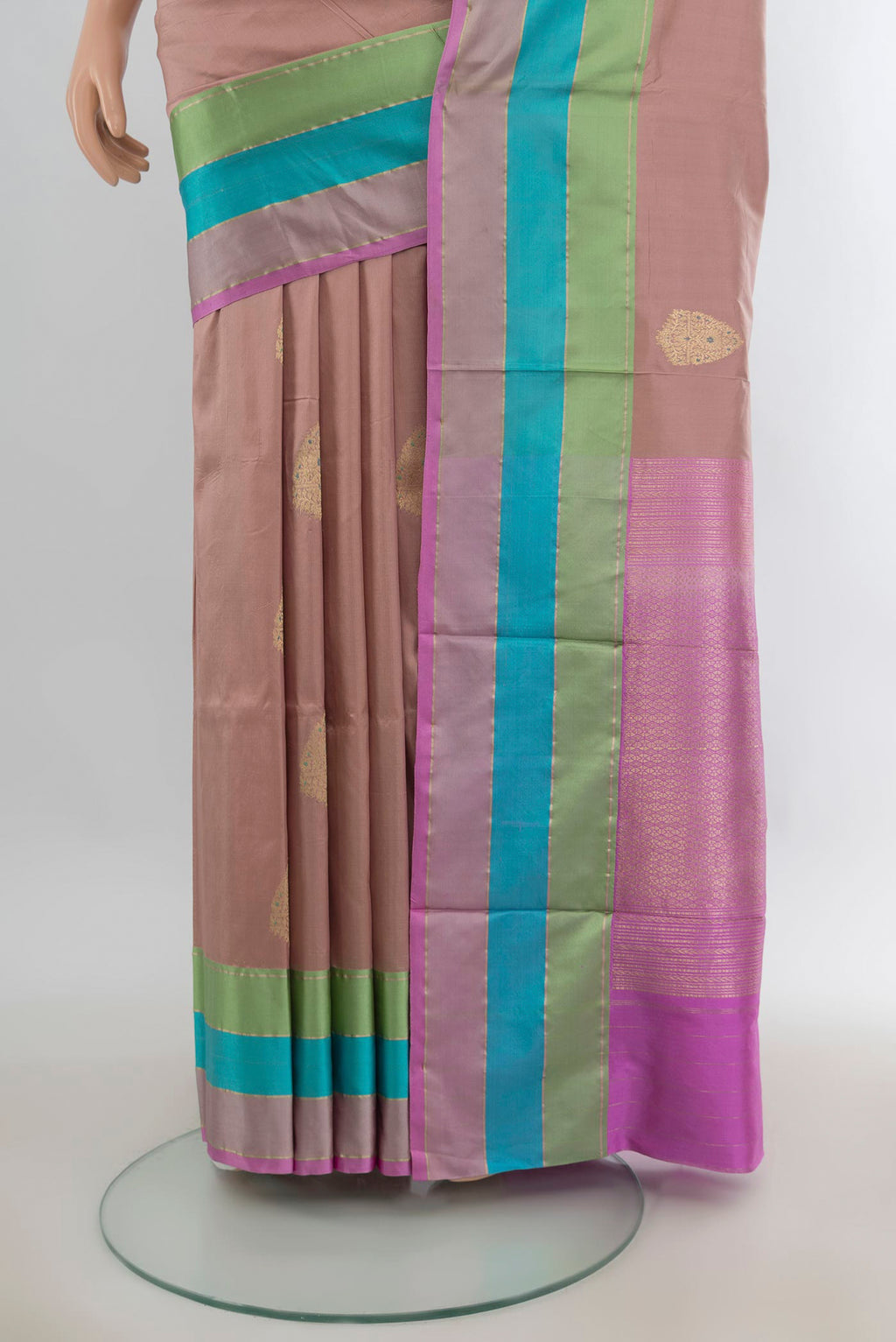 Pleats and pallu of Pure Silk Rose Gold Banarasi Katan Saree with Zari Butta on the body and Zari Border. 