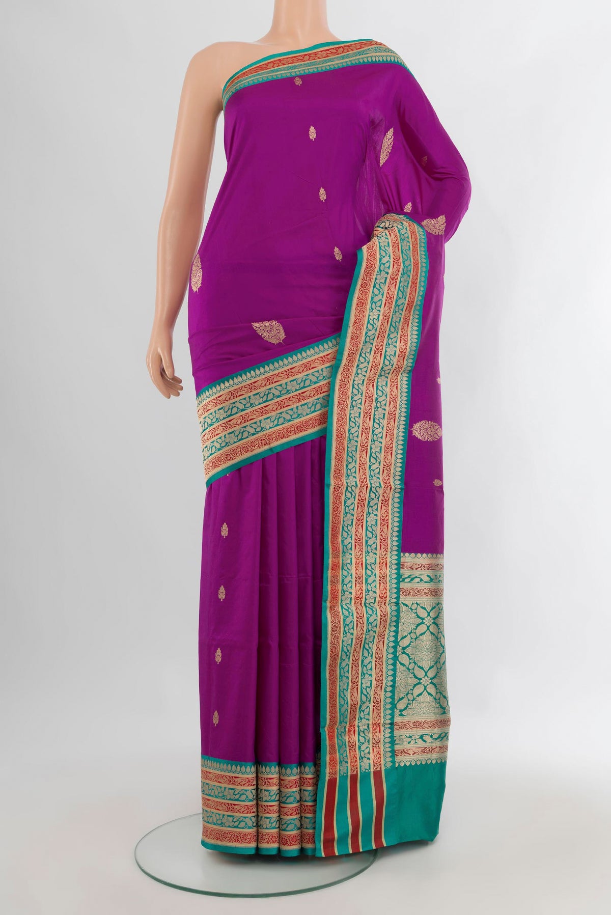 Pure Silk Magenta Banarasi Katan Saree with Zari Butta on the body and Zari Border.  displayed on a mannequin