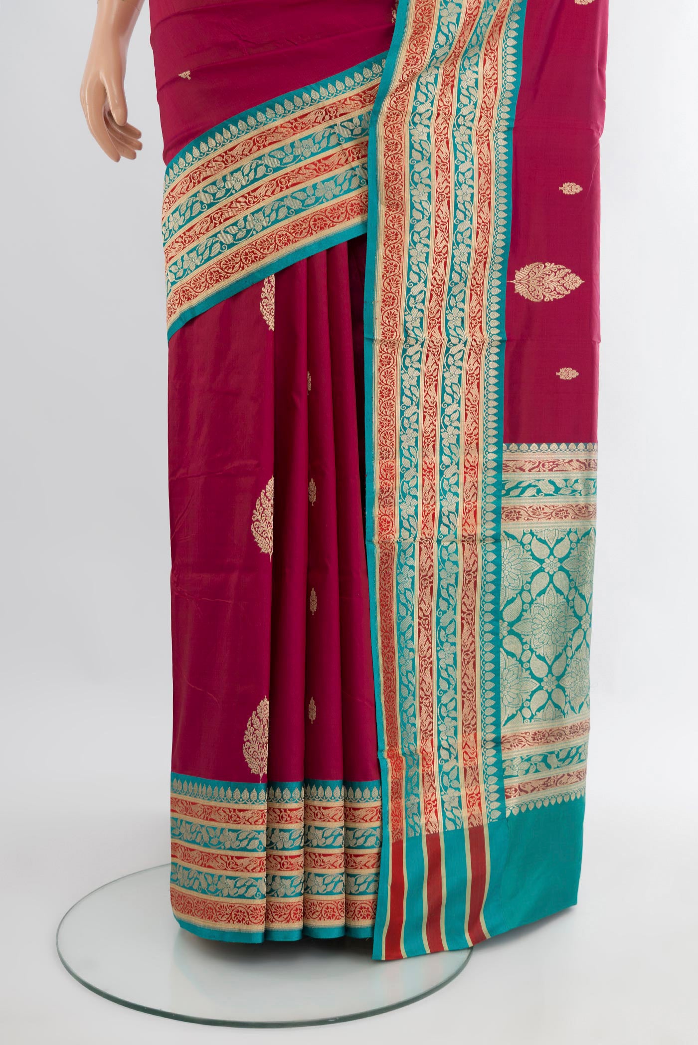 Pleats and pallu of Maroon Banarasi Katan Silk Saree with Zari Butta on the body and Zari Border. 