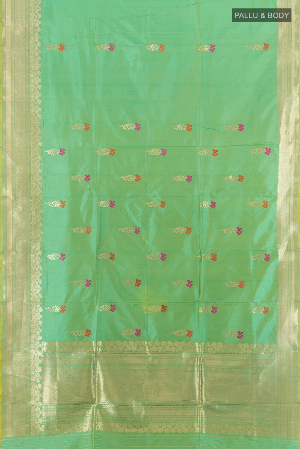 Flat view of Light Green Banarasi Katan Silk Saree with Zari Butta on the body and Zari Border. 