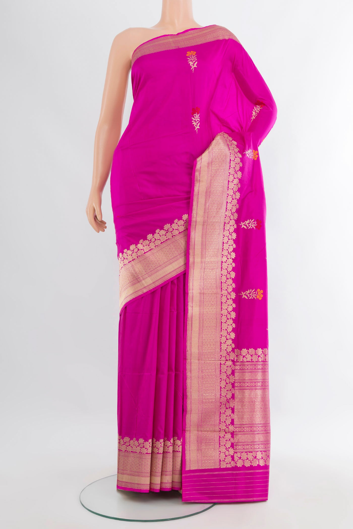 Rani Pink Banarasi Katan Silk Saree with Zari Butta on the body and Zari Border.  displayed on a mannequin