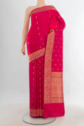 Pure Silk Dark Pink Banarasi Katan Saree with Zari Butta on the body and Zari Border.  displayed on a mannequin