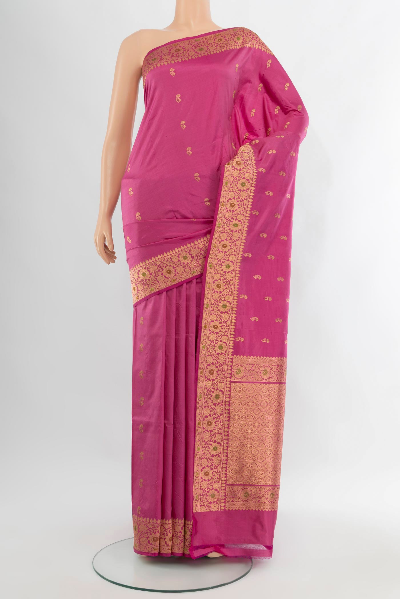 Pink Banarasi Katan Silk Saree with Zari Butta on the body and Zari Border.  displayed on a mannequin