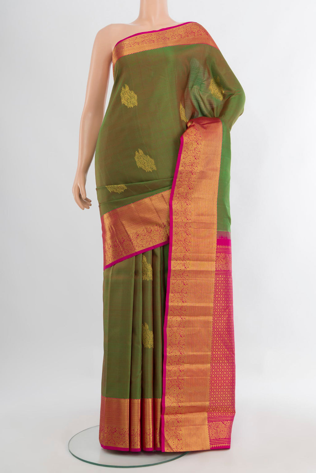 Pure Silk Pure Zari Light Green Kanjivaram Saree with Zari Butta on the body and Silk Border.  displayed on a mannequin