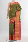 Pure Silk Pure Zari Light Green Kanjivaram Saree with Zari Butta on the body and Silk Border.  displayed on a mannequin
