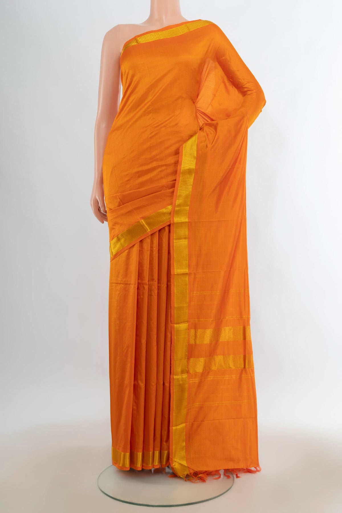 Pure Silk Yellow Kanjivaram Saree with Plain Body and Zari Border.  displayed on a mannequin