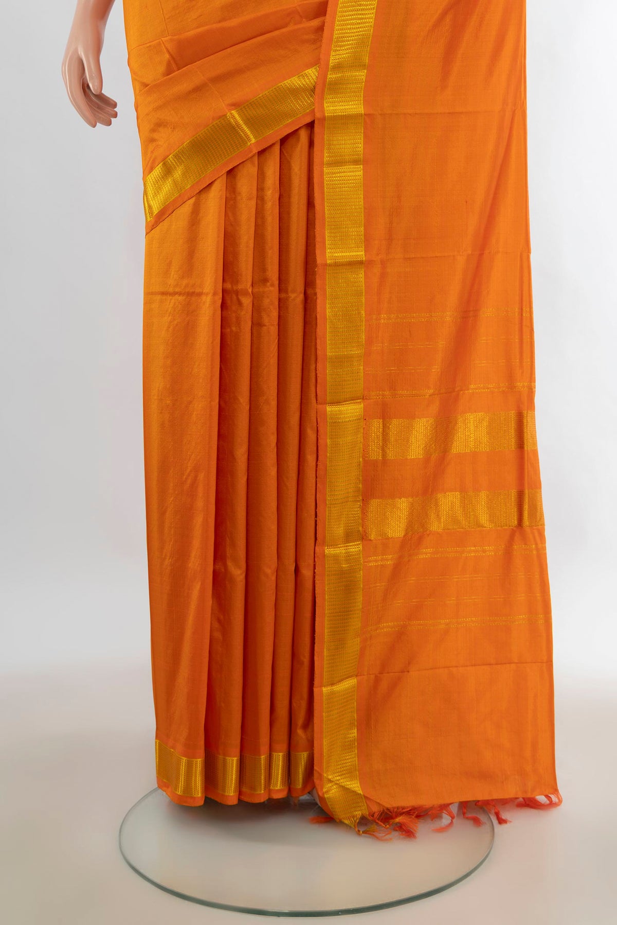 Pleats and pallu of Pure Silk Yellow Kanjivaram Saree with Plain Body and Zari Border. 