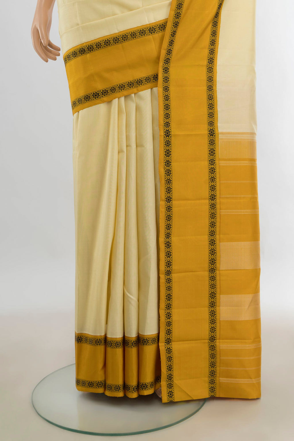 Pleats and pallu of Pure Silk Cream Kanjivaram Saree with Plain Body and Silk Border. 