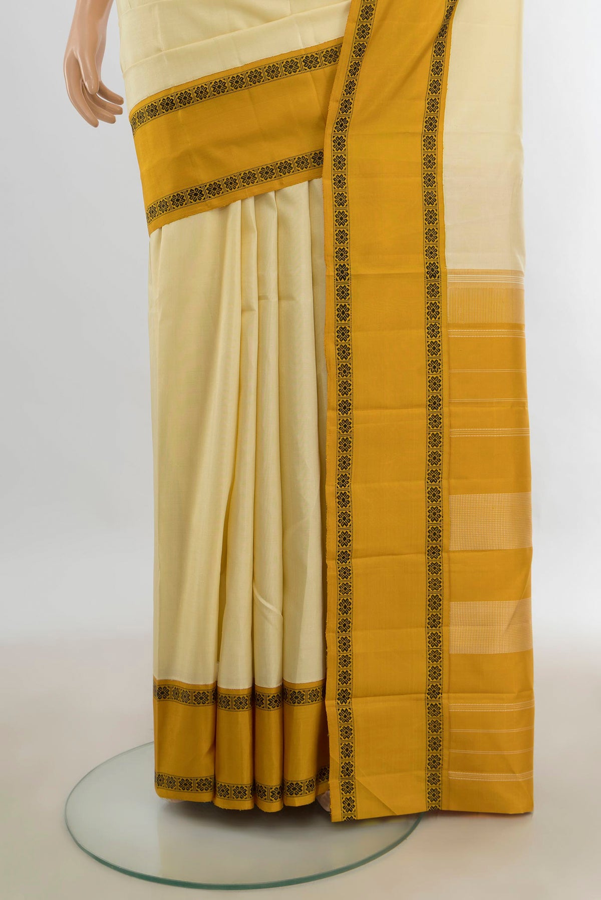 Pleats and pallu of Pure Silk Cream Kanjivaram Saree with Plain Body and Silk Border. 