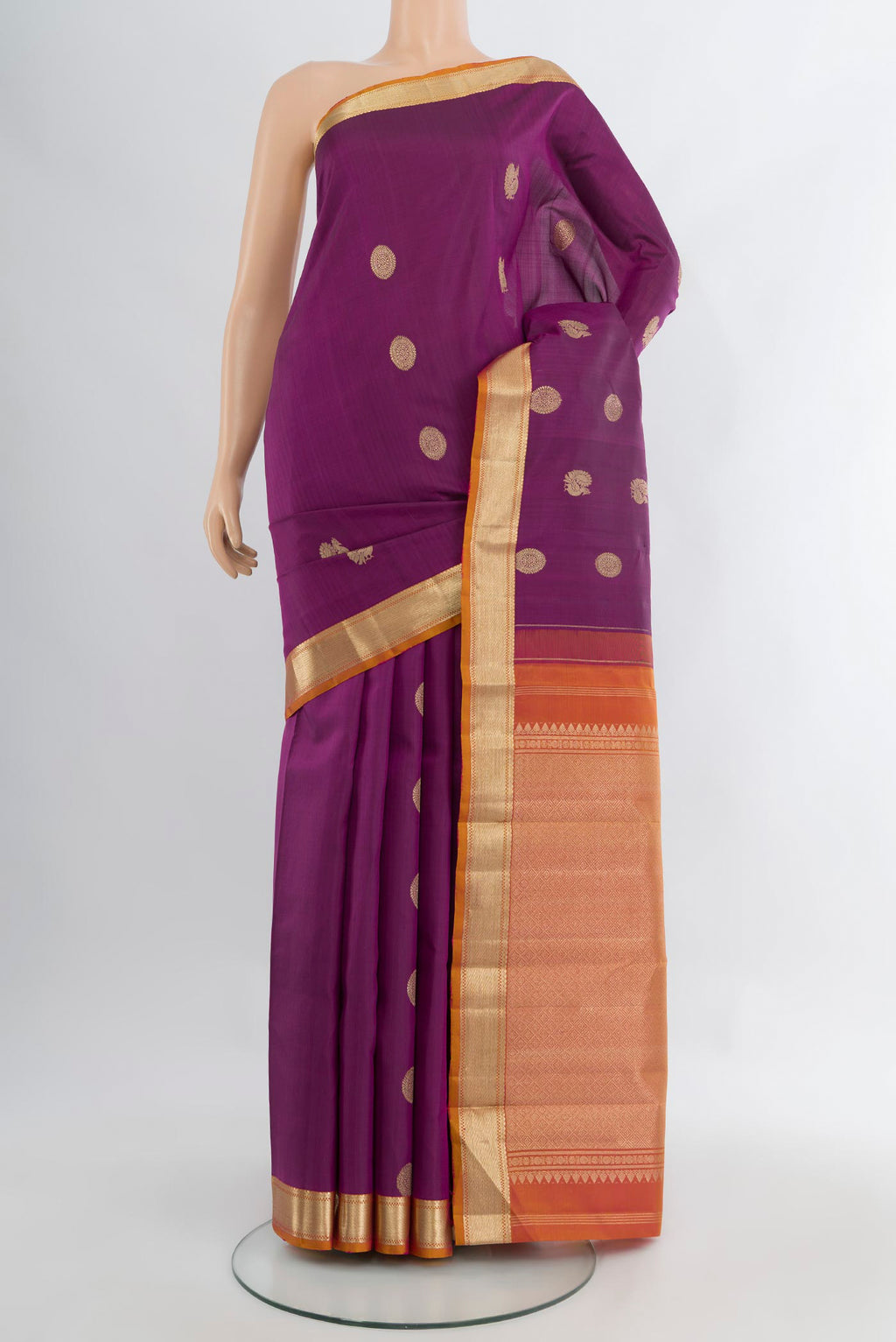 Purple Kanchipuram Silk Saree with Zari Butta on the body and Zari Border.  displayed on a mannequin