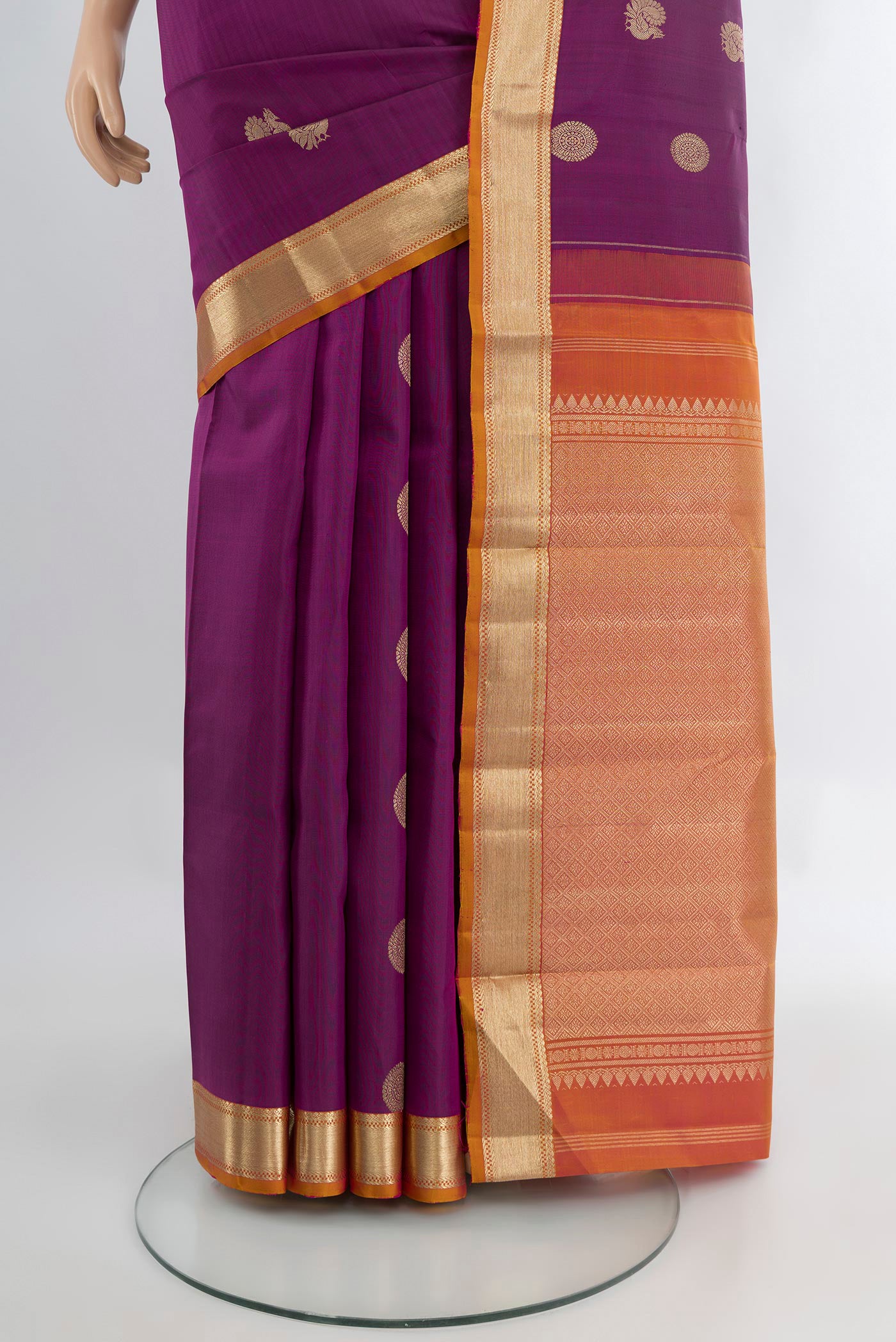 Pleats and pallu of Purple Kanchipuram Silk Saree with Zari Butta on the body and Zari Border. 